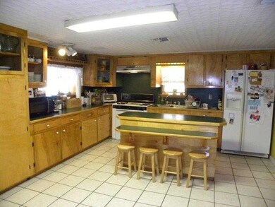 Kitchen. Lots of cabinets, island and pantry