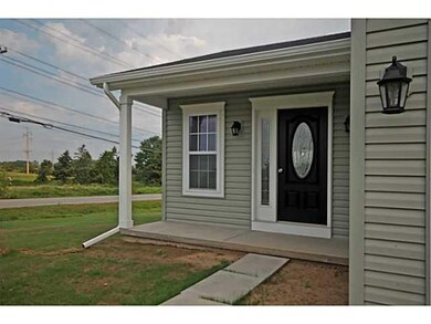 Exterior Front. View of front entry.  Photos repre