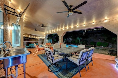 View of patio / terrace with a ceiling fan, outdoo