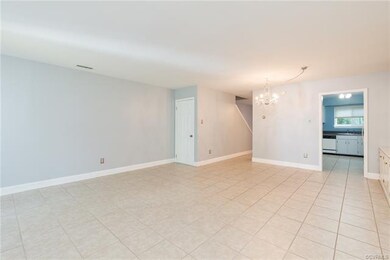 Open plan that combines dining area and famly room, looking back toward kitchen.