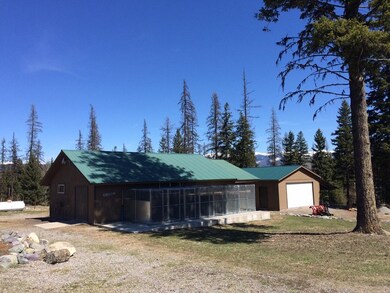 Durand shop, concrete patio and garage