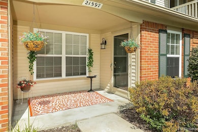 Doorway to property featuring brick siding