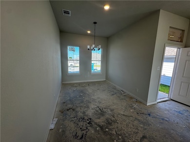 Unfurnished dining area featuring a chandelier and recessed lighting