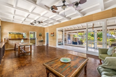 Large open living room has vaulted ceiling and par
