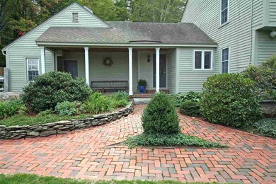 Brick walkways, granite fences and lamp posts lead