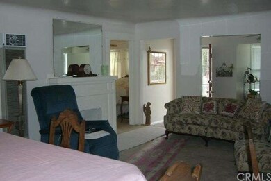 Living room and sun room and first bedroom