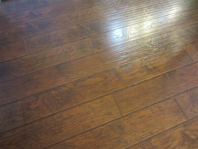 New wide plank wood laminate floors throughout the