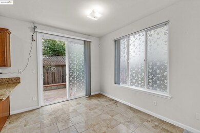 Unfurnished dining area featuring baseboards