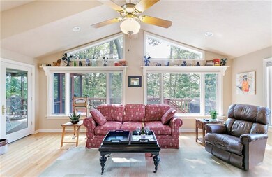 The large family room windows and skylight flood t