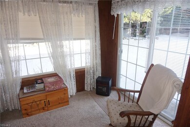 Sunroom with view and access to back yard