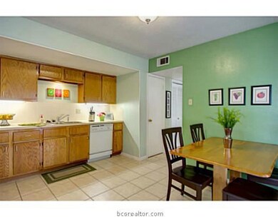 Kitchen. With access to the back, this tile kitchen sports ample cabinet space, with undermount lighting, and a breakfast area perfect for that morning cup of coffee.