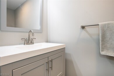 Half bathroom featuring vanity