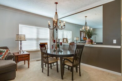 Spacious dining area with mirrored wall