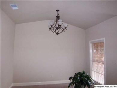 Separate formal dining room with vaulted ceiling -