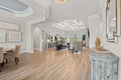 Foyer entrance with coffered ceiling, a notable ch