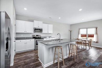 Granite countertops with stainless steel appliances.