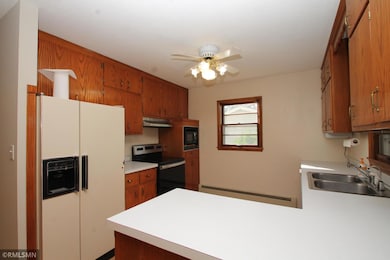 The kitchen has abundant cabinetry and counter space.