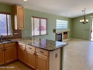Kitchen into dining area with fireplace