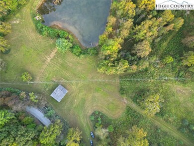 Access, barn and pond at the front of the acreage.