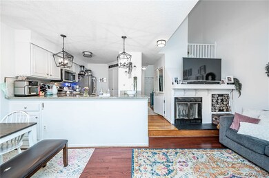 Kitchen with an inviting chandelier, stainless ste