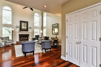 SHIMMERING WOOD FLOORS EXTEND THROUGH MAIN LEVEL L