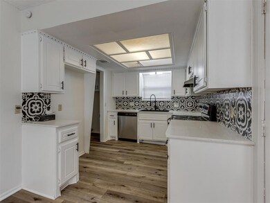Kitchen with appliances with stainless steel finis