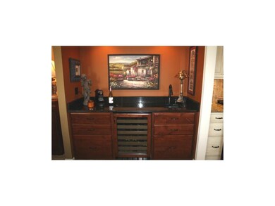 Wet bar with liquor drawers and wine refrigerator