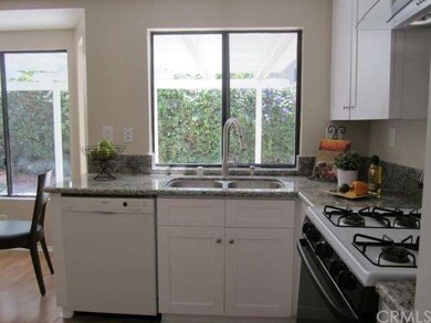 Window view of the remodeled kitchen with stainles