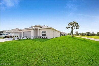 Ranch-style home with a front lawn and a garage