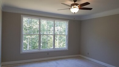 Master bedroom is on the main level along with two more bedrooms.  Look at the trim - extensive through the main level!