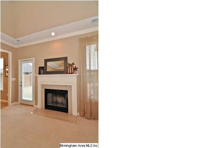 Cozy fireplace and door to incredible, private bac