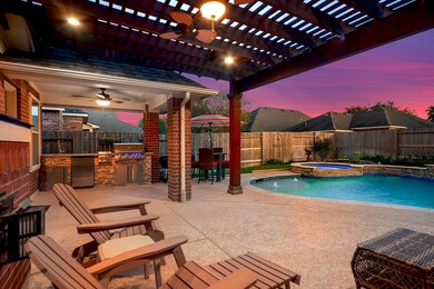 The owner spared no expense in creating this backyard retreat and throughout the entire home. It's truly equipped with top-of-the-line features, including spacious covered patios and a complete outdoor kitchen.