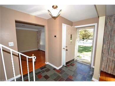 FRONT HALL WITH SLATE FLOORING OPENS TO DINING ROO