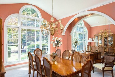 The tall, vaulted ceiling and huge window provide 