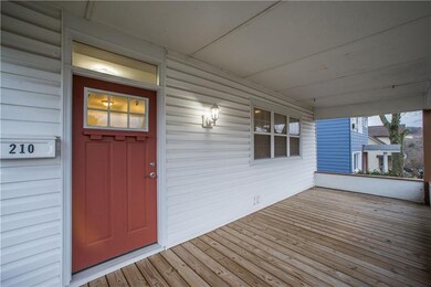 The covered front porch is a welcoming touch and a