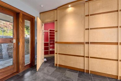 Hidden Closet. Custom Wood Paneling.