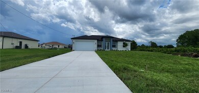 Ranch-style home featuring driveway, a front yard,