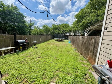 View of yard featuring a trampoline