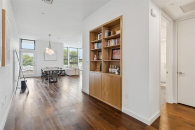 Hall featuring dark wood-type flooring and basebo