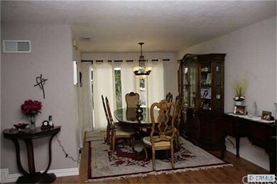 Dining room with sliders to backyard