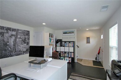Just off the entry is the light bright home office