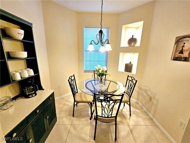 Dining area featuring light tile patterned floors,