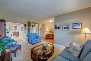 Overall shot from living room into dining room and kitchen