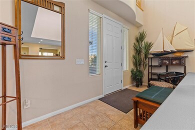 Tiled entrance foyer featuring baseboards