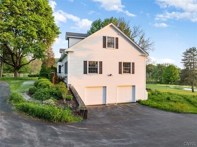 Paved driveway and 2 car garage