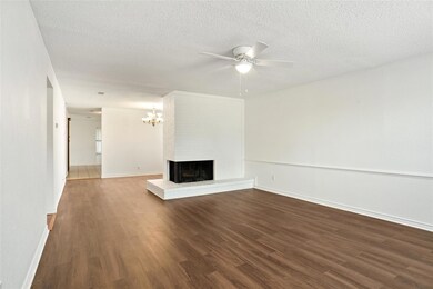 Wood type flooring, and a brick fireplace