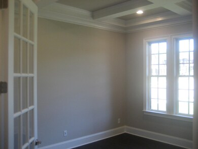 Study with coffer ceiling.  8' French doors at study included in every DREES HOME at Morgan Farms.  10' ceilings first floor with 8' doors and 9' ceilings up on every floor plan.