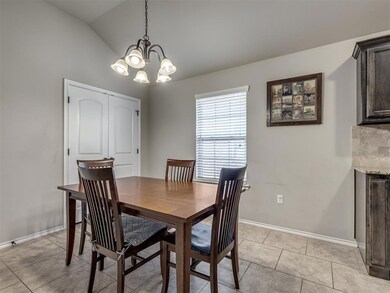 Dining room with an inviting chandelier, light til