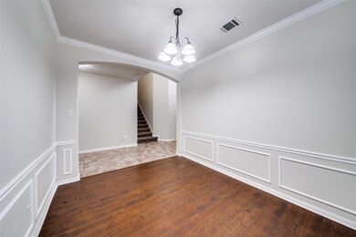Empty room with ornamental molding, arched walkwa