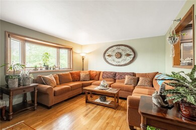 The inviting living room features hardwood floors